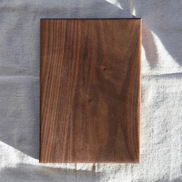 Wooden cutting board on a white background