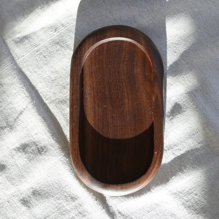 Wooden tray on a light gray background